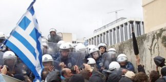 Greek workers and youth confront riot police outside the Vouli in Athens
