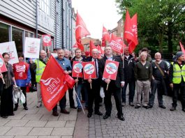 Unite strikers and their regional officers gather outside the King’s Centre rally in Norwich