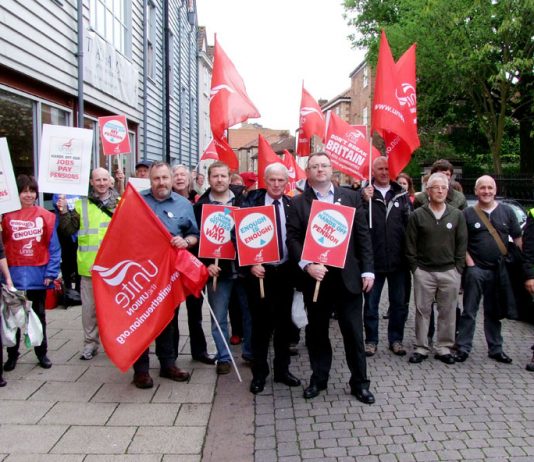 Unite strikers and their regional officers gather outside the King’s Centre rally in Norwich