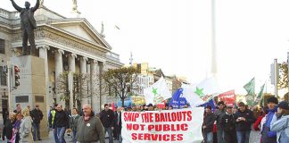 Irish workers marching last November against cuts in public services