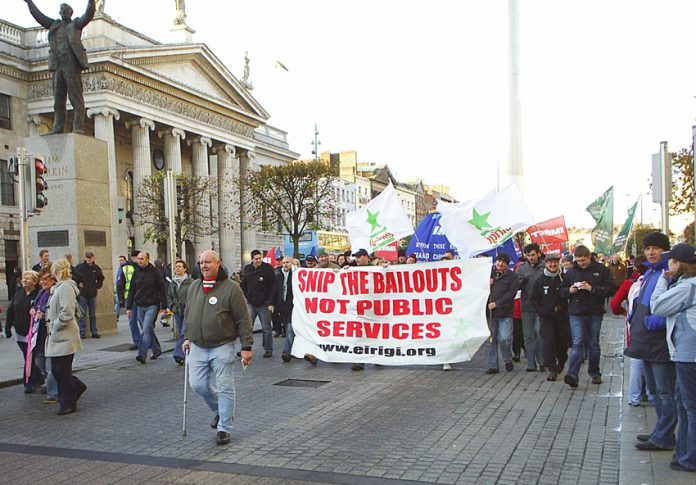 Irish workers marching last November against cuts in public services