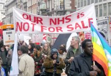 Hospital workers march against the coalition’s NHS cuts