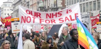 Hospital workers march against the coalition’s NHS cuts