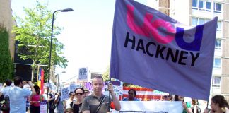 UCU lecturers facing 55 job cuts at Hackney College took to the streets with their banner along with students