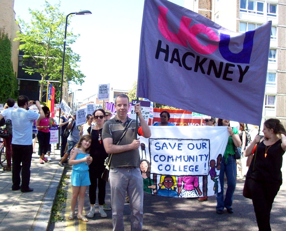 UCU lecturers facing 55 job cuts at Hackney College took to the streets with their banner along with students