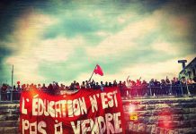 Canadian students at a mass demonstration, the main banner reads: ‘Education is not for sale!’