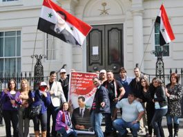 A section of the demonstration last Saturday outside the Saudi embassy in London accusing the Saudi regime of plotting with the Arab League and their imperialist allies to support terrorist attacks in Syria