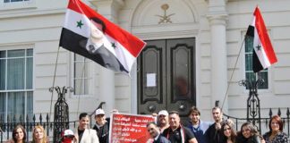 A section of the demonstration last Saturday outside the Saudi embassy in London accusing the Saudi regime of plotting with the Arab League and their imperialist allies to support terrorist attacks in Syria