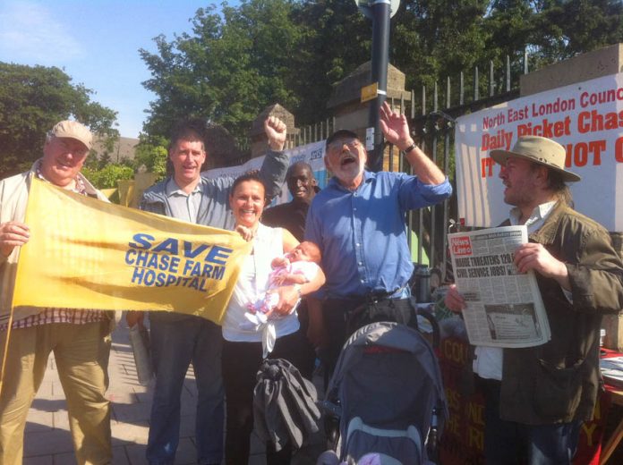 Baby Zoe and mother outside Chase Farm Hospital on the 112th day of the picket of the hospital to keep it open in defence of the NHS. Everybody on the picket line supported the doctors’ struggle to defend their pensions