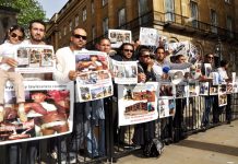 Libyans demonstrate outside Downing Street on Thursday against the NATO-imposed rebel regime in Libya
