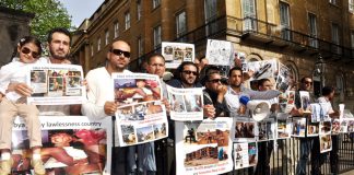 Libyans demonstrate outside Downing Street on Thursday against the NATO-imposed rebel regime in Libya