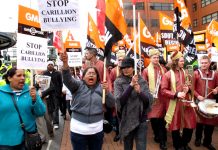 GMB hospital workers marching through Swindon against the bullying of privateer company Carillion