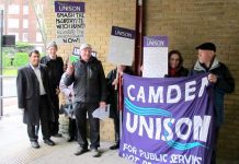 William Westwell (fourth from left, with witch-hunt placard) demonstrating outside the school before the first hearing