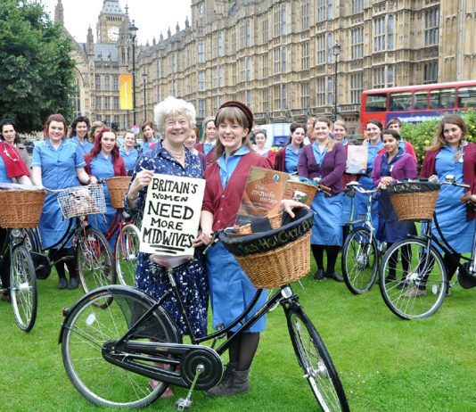 Royal College of Midwives president Lesley Page with midwifery students on vintage cycles yesterday demanding 5,000 more midwives