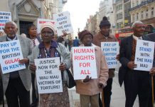 Mau Mau supporters outside the High Court demanding that the British government be held to account for mass murder in Kenya