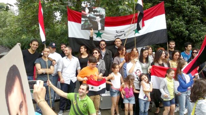 Syrians rally outside their embassy in London on Saturday to express their support for the Russian and Chinese use of their veto against the lastest US-UK resolution at the UN Security Council on Thursday