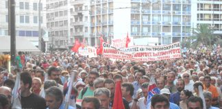 Greek workers on the march in Athens in support of striking steelworkers who have repeatedly been attacked by baton-wielding riot police