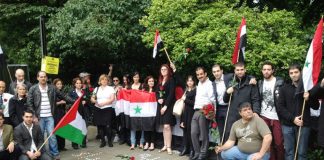 Syrians hold a vigil outside their embassy in London last Thursday to commemorate the Syrian government leaders who died in that day’s terrorist bombing in Damascus