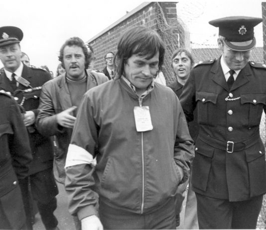 Police lead away Tony Merrick, one of the Pentonville 5, under arrest for picketing at the Midland Coal store in 1972. The dockers organised mass strike action and it took the threat of a general strike to gain their release