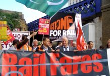 Bob Crow, RMT members and commuters rally at Waterloo Station yesterday to denounce double inflation rise in rail fares and call for re-nationalisation