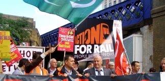 Bob Crow, RMT members and commuters rally at Waterloo Station yesterday to denounce double inflation rise in rail fares and call for re-nationalisation