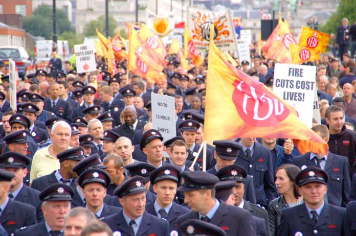 Firemen in London marching to defend jobs and halt cuts so as to be able to protect the lives and homes of Londoners. It is the same issue all over the country