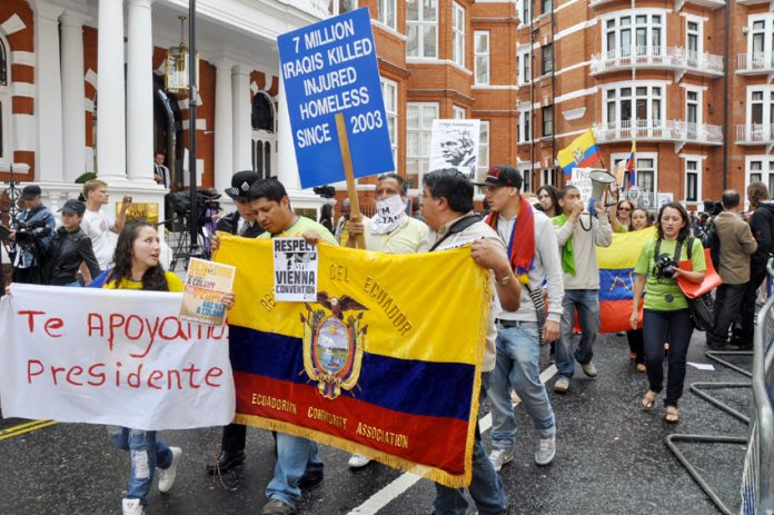 Supporters of Julian Assange demonstrate outside the embassy of Ecuador yesterday afternoon