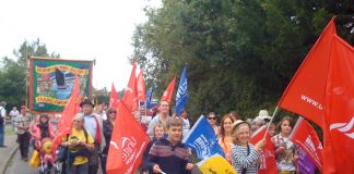 An enthusiastic delegation of children waved flags and cheered all the marchers