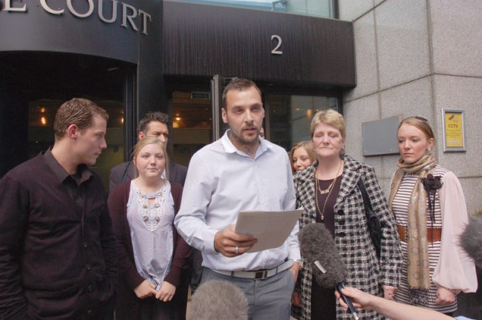 PAUL KING reading out a statement from the Tomlinson family outside the CPS when it was announced that Harwood would be prosecuted for manslaughter