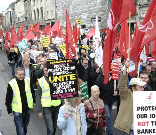 Workers marching in Dublin in defence of jobs