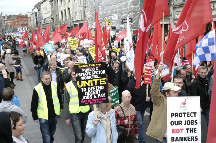 Workers marching in Dublin in defence of jobs