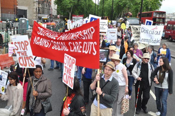 Marching in defence of disabled workers rights in May last year