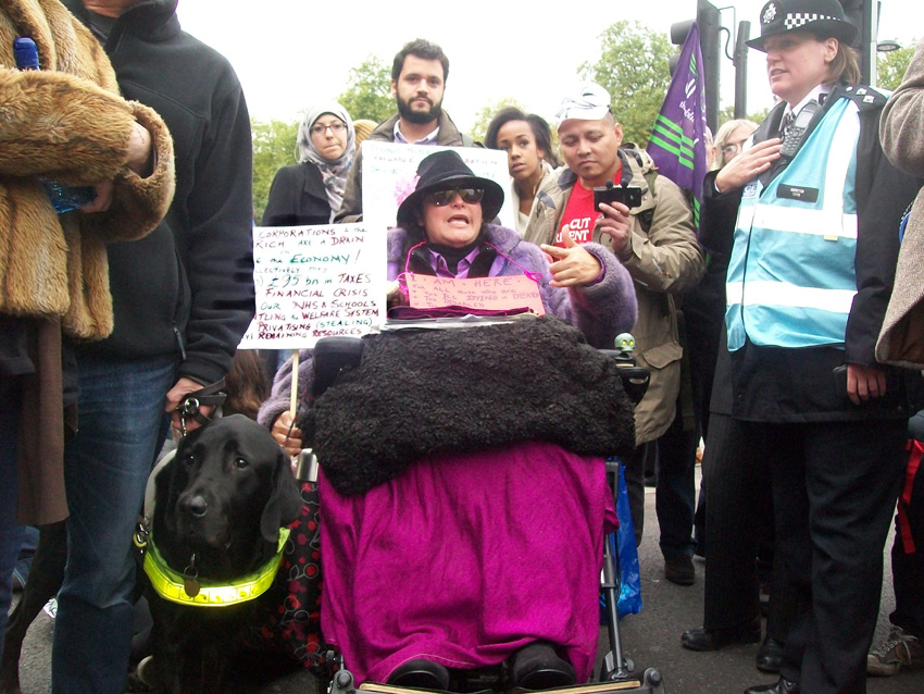 On last Saturday’s TUC demonstration there was a great determination to defend the NHS. Picture shows a disabled campaigner  who blocked the road at Marble Arch to show her anger at the way disabled people are being treated by the coalition