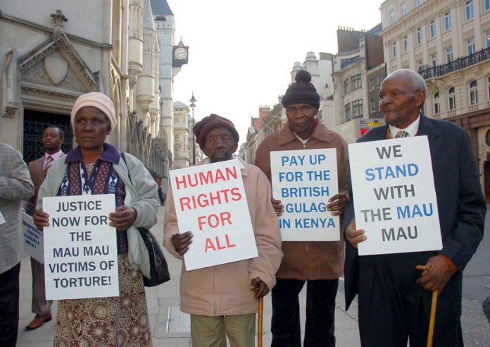 Kenyans who were tortured by British troops, outside the High Court in London