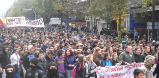 School students marching in Athens the banner reads ‘They have killed Alexis, they are stealing our life – struggle for their overthrow!’