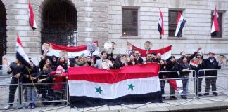 Syrians demonstrate outside the Foreign Office in London to show their support for President Assad against the British government’s support for the opposition