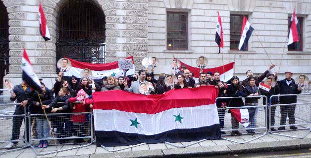 Syrians demonstrate outside the Foreign Office in London to show their support for President Assad against the British government’s support for the opposition