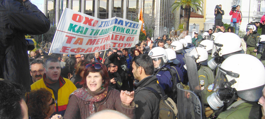 Marchers pushed aside the fence around the Greek parliament and chanted ‘Bread, Education and Freedom’