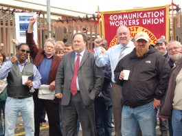 CWU leaders BILLY HAYES and DAVE WARD (centre figures) on the picket line at Mandela Way in south east London during the last national strike action in 2009