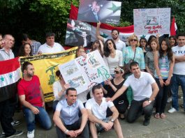 Syrian youth outside their embassy in London last August showing their support for president Assad