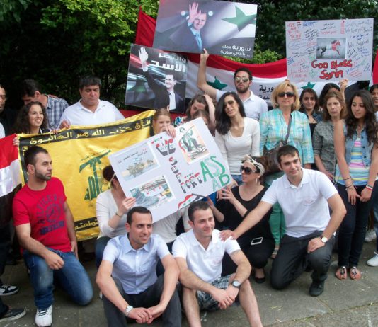 Syrian youth outside their embassy in London last August showing their support for president Assad