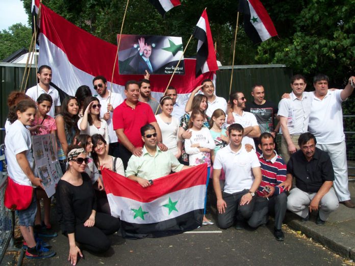 Youth and workers rally in support of Assad in central London outside the Syrian embassy