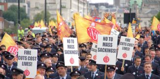 London firefighters demonstrating against mass sackings and emphasising that closing fire stations and cutting the service will cost lives