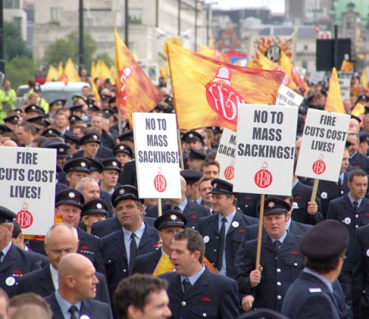 London firefighters demonstrating against mass sackings and emphasising that closing fire stations and cutting the service will cost lives