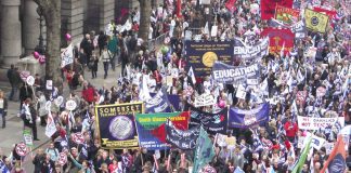 NUT banners on the march. The NUT regards league tables as a distraction from the hard work teachers do