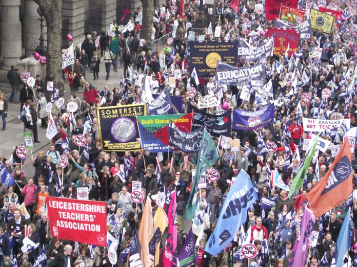 NUT banners on the march. The NUT regards league tables as a distraction from the hard work teachers do