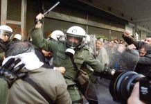 Greek riot police attack trade unionists with tear gas and truncheons outside the Labour Ministry