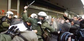 Greek riot police attack trade unionists with tear gas and truncheons outside the Labour Ministry