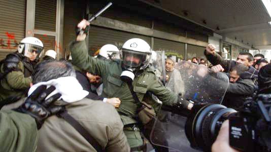 Greek riot police attack trade unionists with tear gas and truncheons outside the Labour Ministry