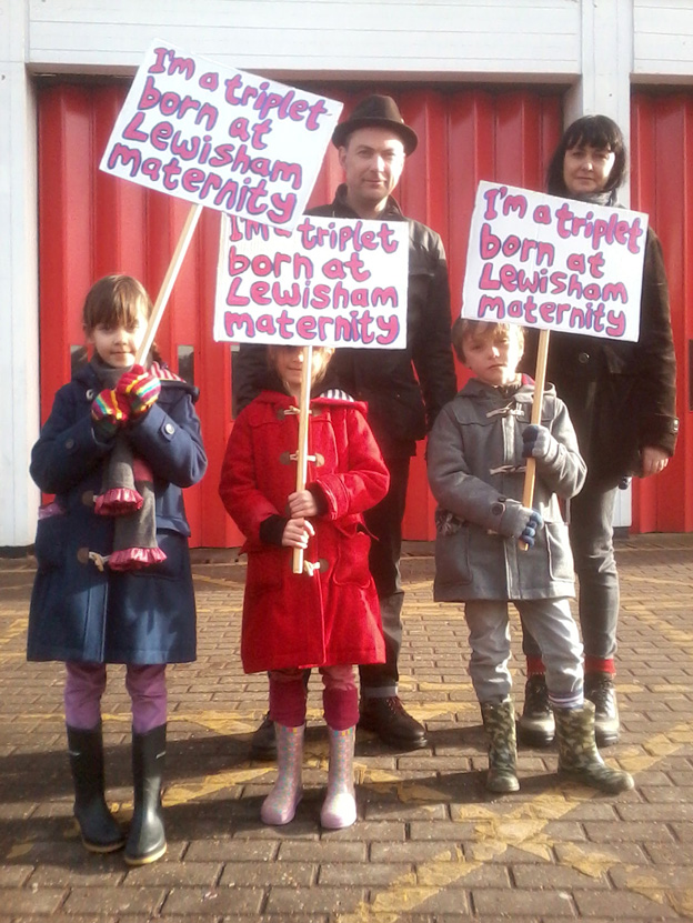 SARAH and BEN NORRIS with their triplets EVE, LOLA and DYLAN took part In the march to defend Lewisham Hospital on November 26